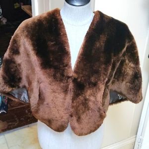 Furs by Millard, San Diego,CA. Women's fur shawl with button and side pockets.